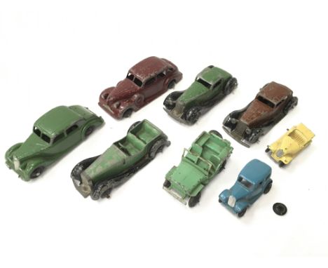 Eight Dinky Toys post-war cars, includes 36c Humber Vogue in brown, 40a Riley Saloon in green with black hubs and two smaller