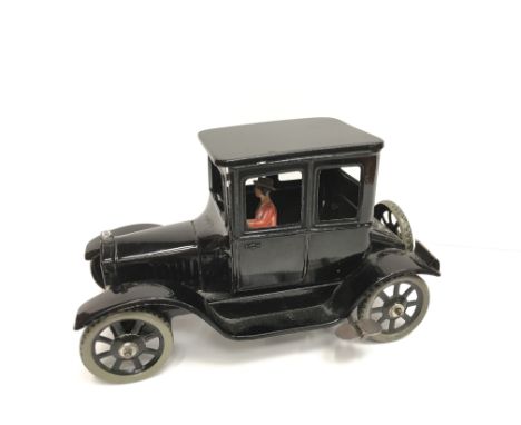 Bing (Germany) Model T Ford Sedan, black tinplate clockwork model with spoked wheels, grey tinplate tyres, lady driver and fi