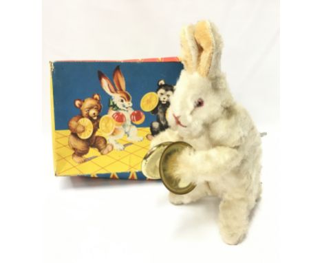 Original Toys (W. Germany) Rabbit: tinplate clockwork flock-covered rabbit with cymbals, height 19cm. G+ with label, motor in