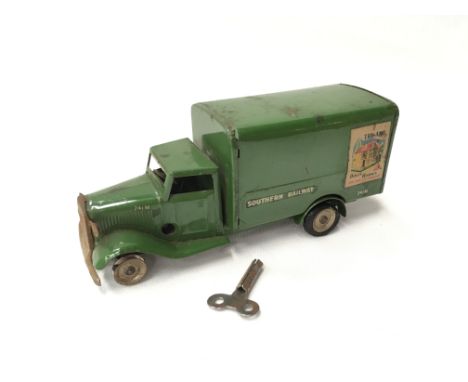 Triang Minic 82M Southern Railway Delivery Van: green tinplate clockwork model with 'Triang Dolls Houses' and 'IMA Electric M