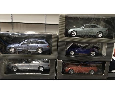 Five 1/18 scale Mercedes diecast models. Appear E/M and boxed. 