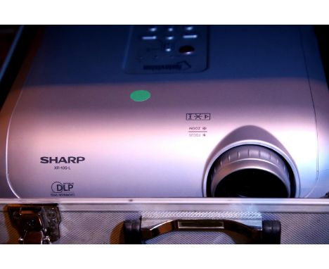 Sharp KR 105-L cased projector with remote (Note Vision). Not available for in-house P&P, contact Paul O'Hea at Mailboxes on 