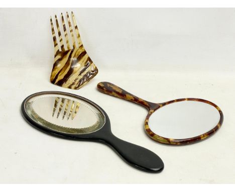 A Victorian faux tortoise shell hair comb and 2 vanity mirrors. 