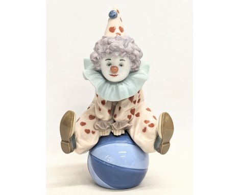 A signed Lladro pottery figure, 'Having a Ball.' 18cm 