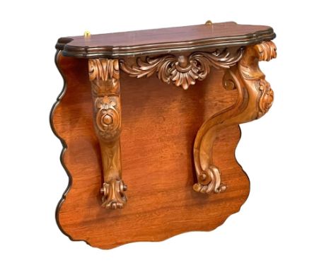 A large Victorian carved mahogany wall bracket. 71x33x75cm 