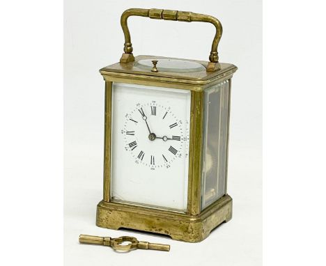 A good quality late 19th century Kands brass carriage clock with key. France. 9.5x8.5x18cm including handle. 
