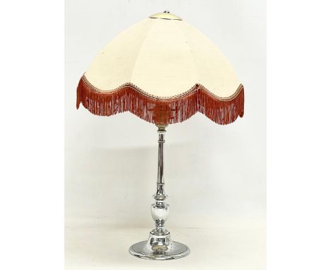 A 1930’s Art Deco chrome table lamp with shade. Base measures 32cm without shade. 