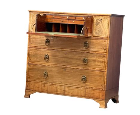 A large George IV inlaid mahogany secretaire chest of drawers with rosewood cross banding and original brass ring handles on 