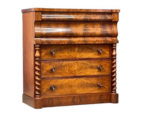 A large Victorian feathered mahogany Scotch chest of drawers with barley twist columns. 124x59x131cm 