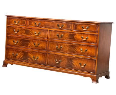 A large Georgian style inlaid mahogany chest of drawers on splayed bracket feet. 152x46.5x78.5cm 