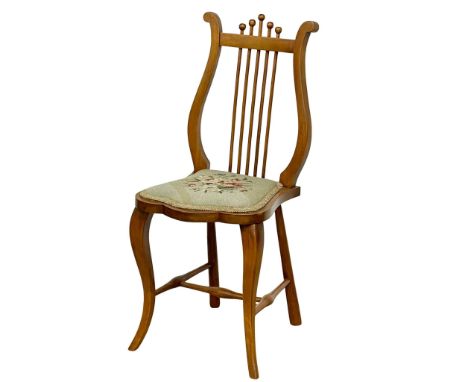 An Edwardian walnut Lyre back chair with tapestry seat. 