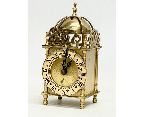 A vintage brass clock by Smiths Industries Limited. 17cm 