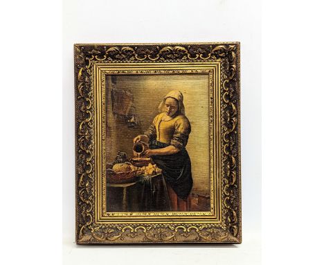 A vintage oleograph of Jan Vermeer Van Delft's 'The Milkmaid,' in ornate gilt frame. 28x33.5cm with frame, 17.5x23.5cm 