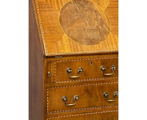 A good quality fine proportioned Georgian style inlaid mahogany writing bureau with brass drop handles on bracket feet. 43x40