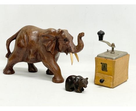 A sundry lot. A vintage coffee grinder, a large elephant and a bear. Elephant 34x20cm 