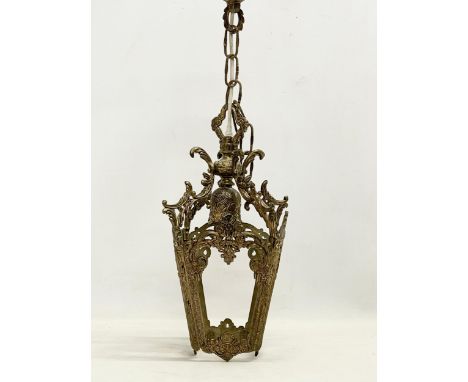 A vintage ornate brass ceiling light. 50cm including chain. 