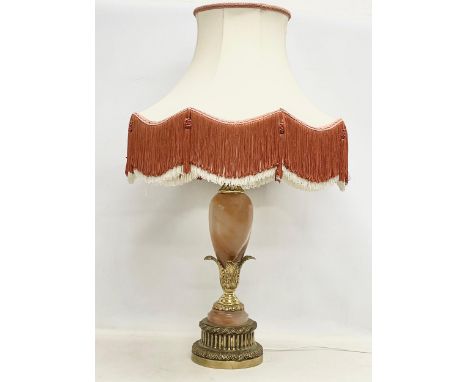 A large vintage ornate brass and onyx table lamp. Base measures 68cm. 97cm including shade. 