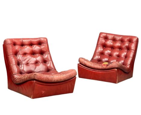 A pair of 1970’s Mid Century leather lounge chairs. 79x102x79cm 