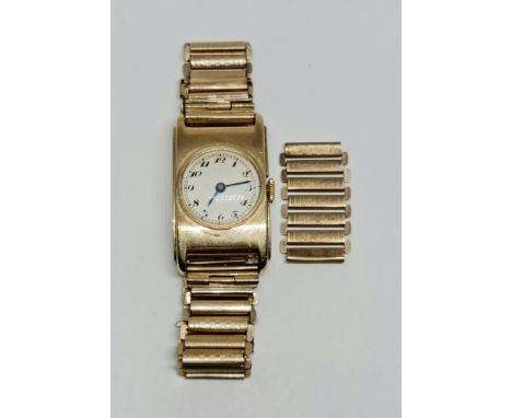 A 9ct yellow gold cased wrist watch, the silver-tone dial having hourly Arabic numeral markers, hallmarked Glasgow import, da