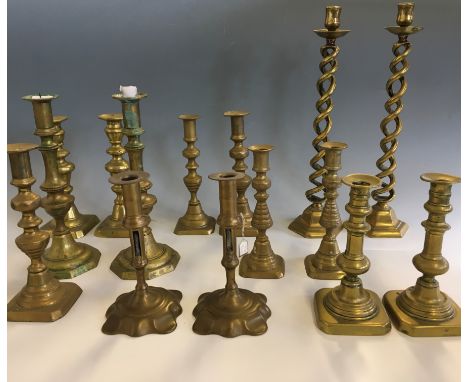 Selection of various brass pairs of candlestick holders. IMPORTANT: Online viewing and bidding only. Collection by appointmen