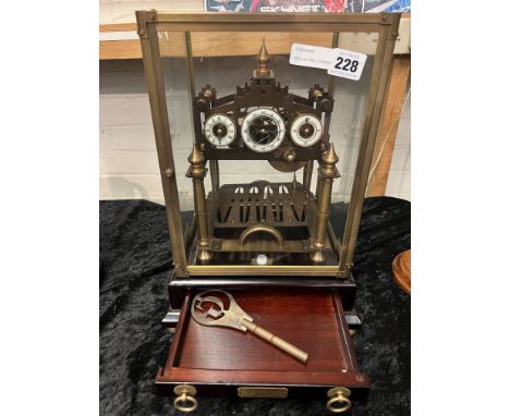 ROLLING BALL CONGEAVE CLOCK IN GLASS CASE