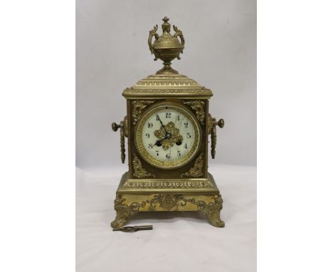 A FRENCH GILT BRASS MANTLE CLOCK WITH KEY 