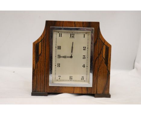 A DECO STYLE OAK  8 DAY MANTLE CLOCK WITH WIND UP MECHANISM SEEN WORKING BUT NO WARRANTY 