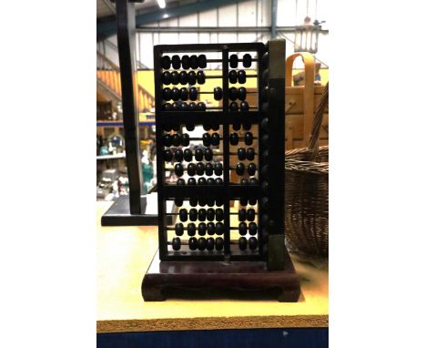 A LARGE VINTAGE WOODEN ABACUS WITH TWO SIDES OF BEADS, HEIGHT APPROX 42CM 