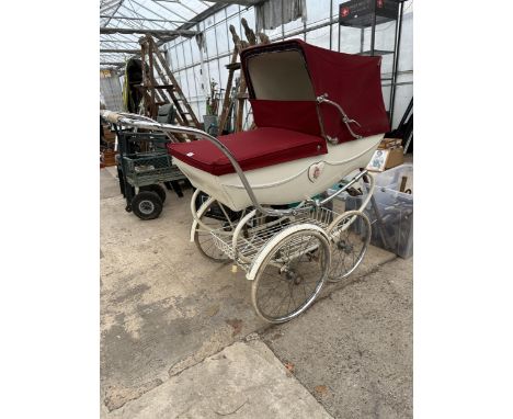 A VINTAGE SILVER CROSS PRAM 