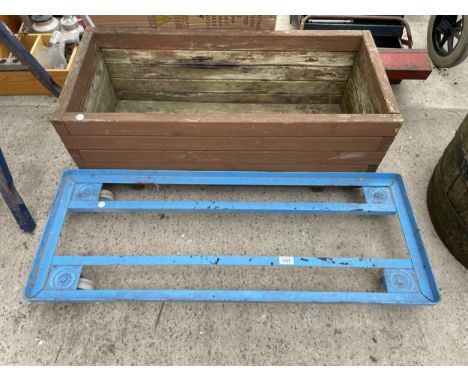 A METAL TROLLEY BASE AND A WOODEN TROUGH PLANTER 