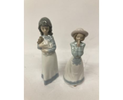 TWO GIRL NAO FIGURINES ONE PRAYING AND ONE HOLDING ADOG 