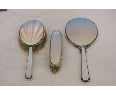 AN ENAMEL AND HALLMARKED LONDON SILVER TWO BRUSH AND MIRROR SET 