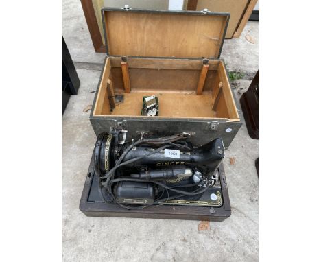 A VINTAGE ELECTRIC SINGER SEWING MACHINE WITH FOOT PEDAL AND CARRY CASE 