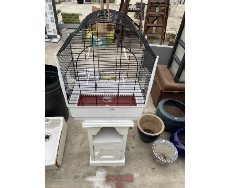 A WOODEN BEDSIDE AND A BUDGIE CAGE 