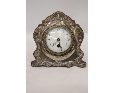 A DECORATIVE HALLMARKED BIRMINGHAM SILVER MANTLE CLOCK 