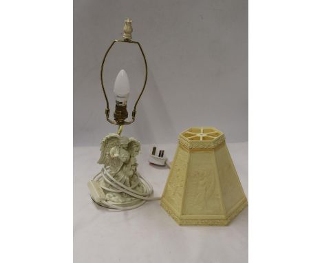 A TABLE LAMP WITH A CLASSICAL FIGURE TO THE BASE AND LAMP SHADE 