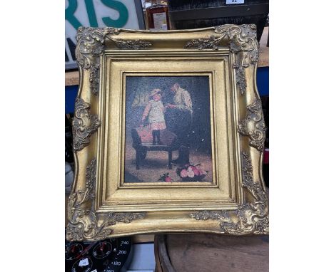 A FRAMED PRINT OF A FATHER AND DAUGHTER IN A GILT FRAME 