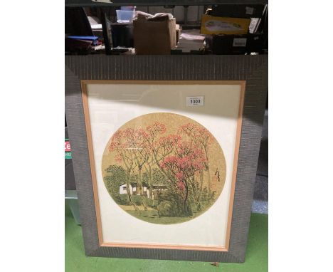 A FRAMED ORIENTAL METALLIC PRINT OF HOUSES AND PRUNUS 