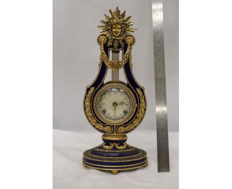 A VICTORIA AND ALBERT MARIE ANTOINETTE STYLE SUN KING GILT METAL MOUNTED PORCELAIN MANTLE CLOCK WITH WHITE ROMAN DIAL AND A M