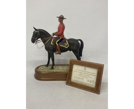 A ROYAL WORCESTER MODEL OF A ROYAL CANADIAN MOUNTED POLICEMAN  MODELLED BY DORIS LINDNER AND PRODUCED IN A LIMITED EDITION OF