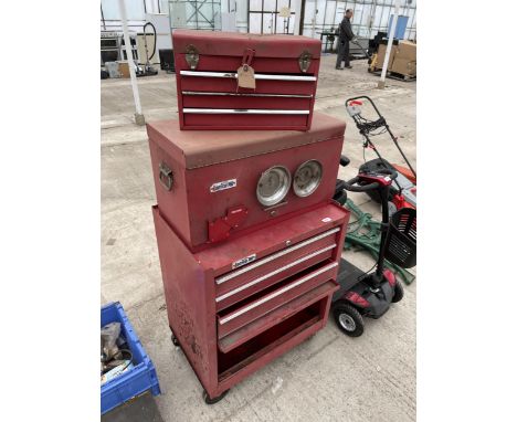 A METAL FOUR WHEELED WORKSHOP TOOL BOX AND TWO FURTHER TOOL BOXES 