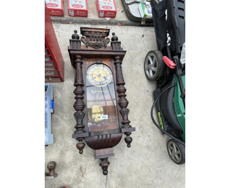 A VINTAGE WOODEN CASED WALL CLOCK 