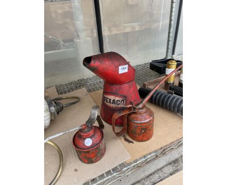 A VINTAGE TEXACO OIL JUG AND TWO PUMP ACTION OIL CANS 