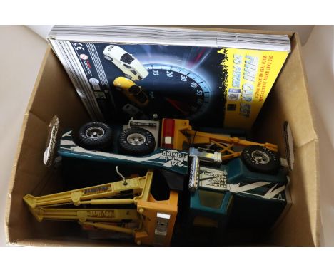 TWO LARGE TOY WRECKER TRUCKS, A TOY SCANIA CAR TRANSPORTER AND CARS AND A BOXED WELLY 20 PIECE TOY CAR SET 