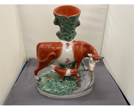A VINTAGE STAFFORDSHIRE FLATBACK COW AND CALF SPILL HOLDER, HEIGHT 30CM 