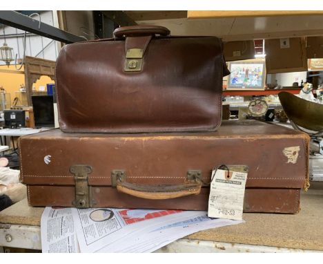 A VINTAGE LEATHER SUITCASE WITH A CANADIAN PACIFIC RAILWAY LABEL PLUS A VINTAGE LEATHER BRIEFCASE 