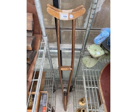 A PAIR OF VINTAGE WOODEN CRUTCHES 