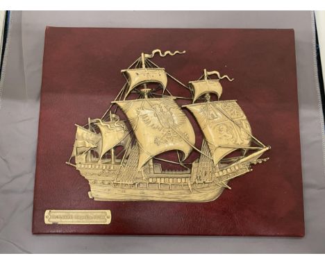 A VINTAGE EMBOSSED SPANISH GALLEON ON RED MOROCCO LEATHER, 30CM X 24CM 