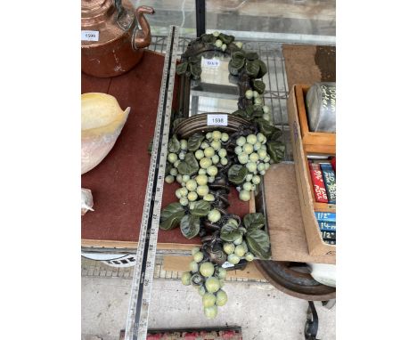 A VINTAGE AND DECORATIVE GRAPE VINE MIRROR 