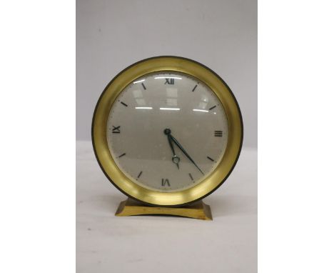A VINTAGE CIRCULAR MANTLE CLOCK 